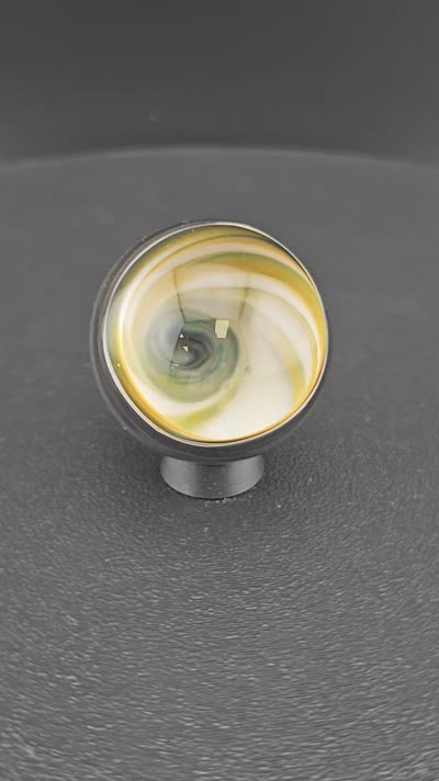Yellow vortex glass marble K14