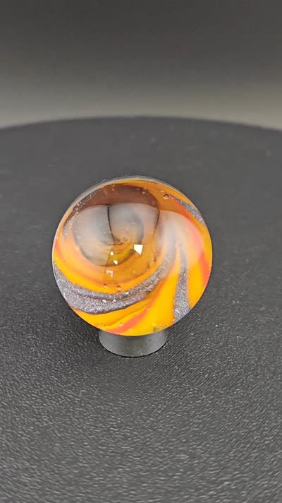 Orange vortex glass marble K18